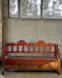 Red wooden bench with openable seat