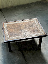 Coffee table with a leather world map inlay