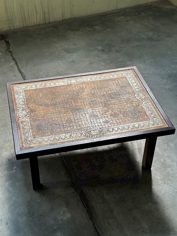 Coffee table with a leather world map inlay