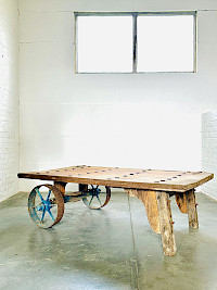 Rustic industrial coffee table on wheels