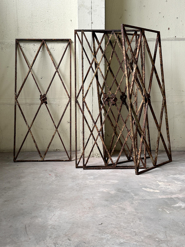 Collection of five antique iron security grates